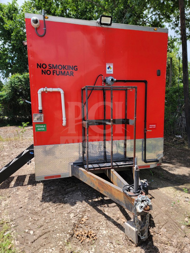 2021 Titanium Cargo 8.5' x 24' tandem-axle mobile kitchen trailer, red, "No Smoking" signage, propane connections visible.