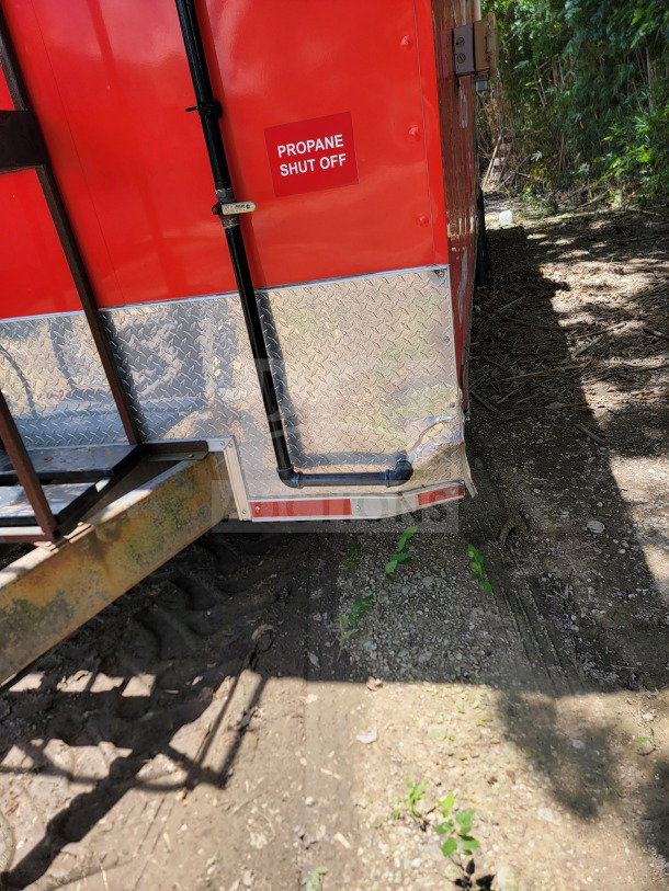 TITANIUM 2021 8.5' x 24' kitchen trailer with propane shut off label, red exterior, diamond plate trim, VIN 7PLBC2421MM000429.