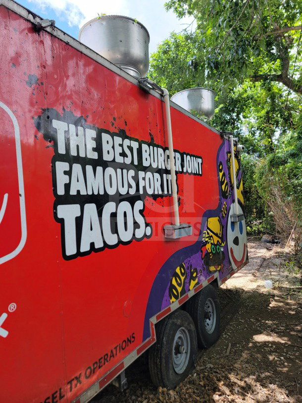 2021 Titanium Cargo 8.5' x 24' mobile kitchen trailer with colorful branding, dual axles, and rooftop vent.