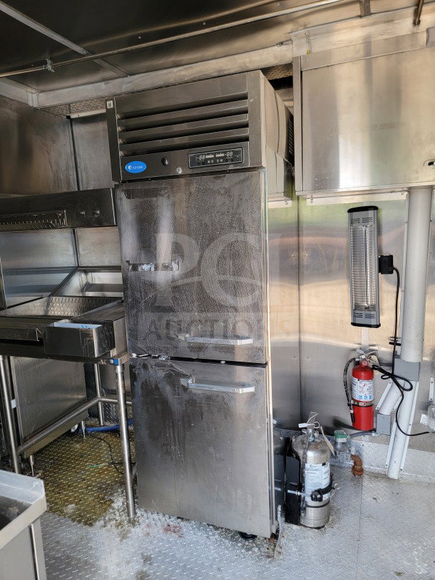 2021 Titanium Cargo 8.5' x 24' Mobile Kitchen Trailer interior with CaptiveAire hood, Randell fridge, Frymaster suite.