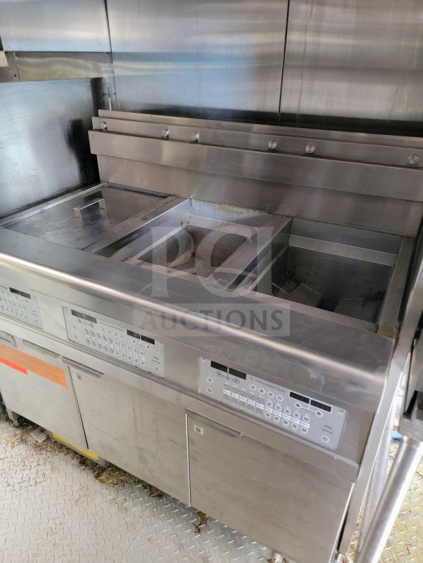 2021 Titanium Cargo 8.5' x 24' mobile kitchen trailer interior, featuring a Randell & Frymaster suite with CaptiveAire hood.