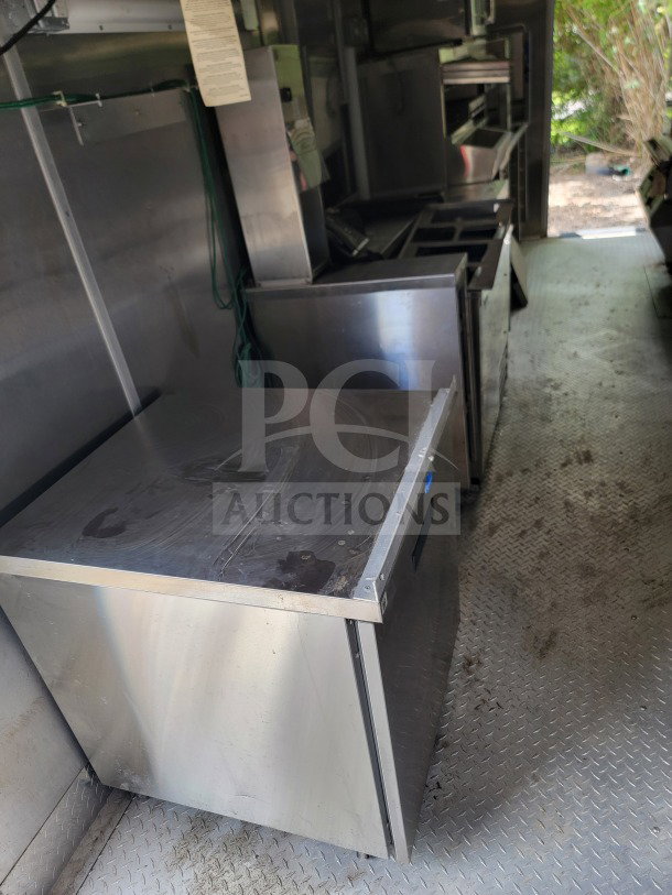 2021 Titanium Cargo 8.5' x 24' mobile kitchen trailer interior with CaptiveAire hood, Randell, Frymaster suite.