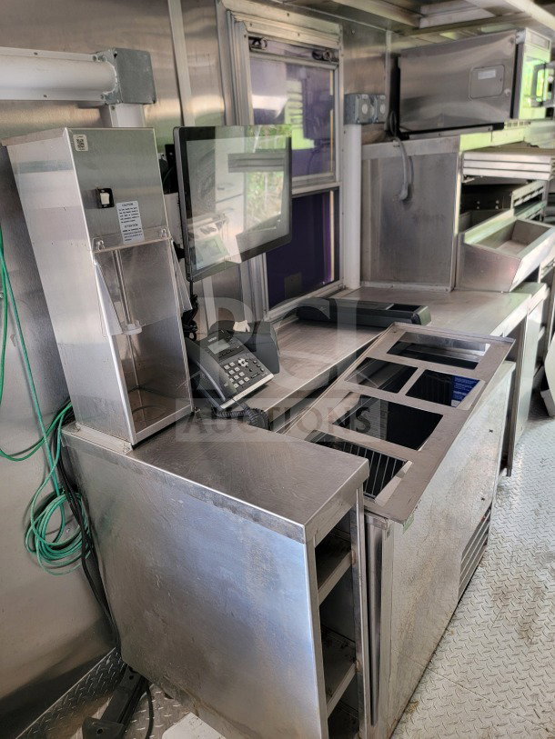 2021 Titanium Cargo 8.5' x 24' mobile kitchen trailer interior, features CaptiveAire hood, Randell & Frymaster suite.
