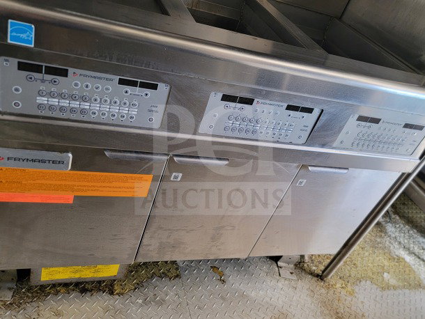2021 Titanium Cargo 8.5' x 24' mobile kitchen trailer interior showing Frymaster control panel and steel cabinetry.
