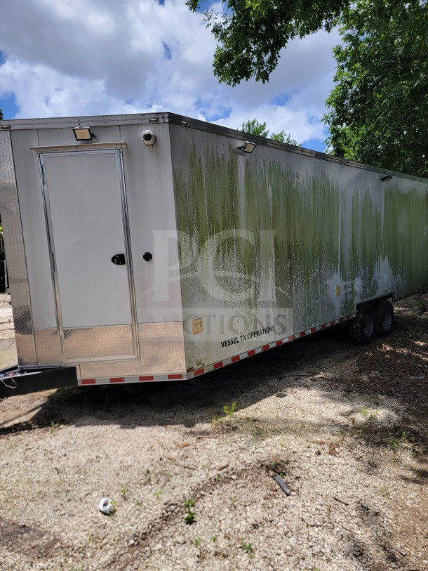 2021 SDG 8.5' x 26' tandem-axle mobile kitchen trailer in worn condition, featuring a corporate configuration.