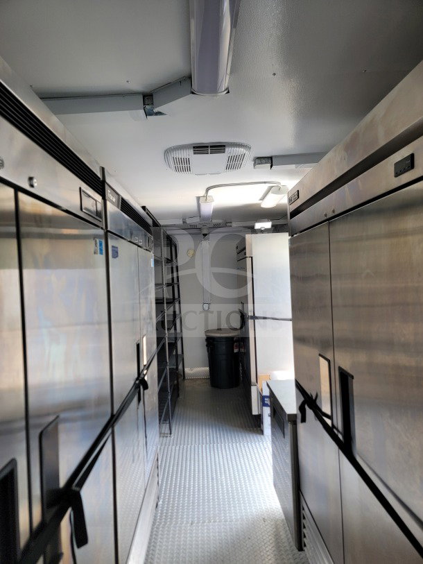 2021 SDG 8.5' x 26' mobile kitchen trailer interior, featuring CaptiveAire hood, Turbo Air/True refrigeration, pristine condition.