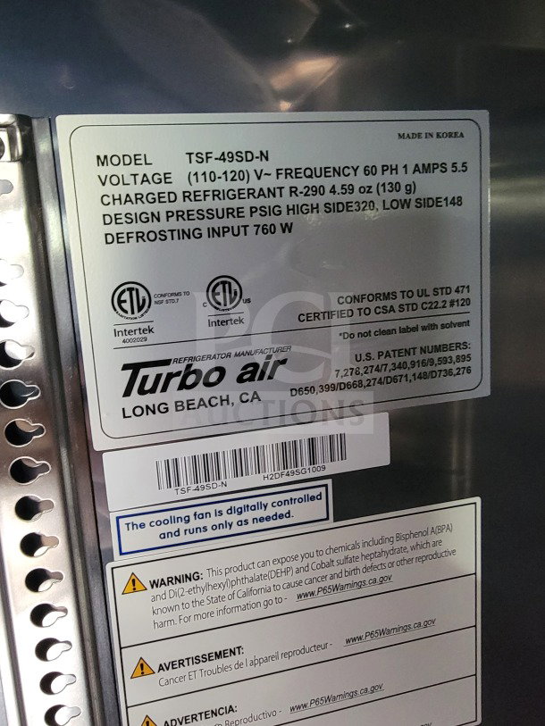Turbo Air label on refrigeration unit for mobile kitchen trailer; Model TSF-49SD-N, voltage 110-120V, includes safety warnings.