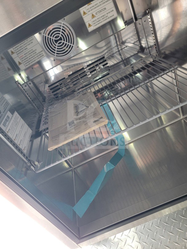 Interior of 2021 SDG 8.5' x 26' mobile kitchen trailer showing stainless steel shelving and ventilation fan.