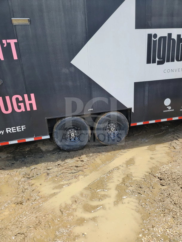 2021 SDG 8.5' x 20' mobile fulfillment trailer, tandem-axle, visible branding, muddy condition.