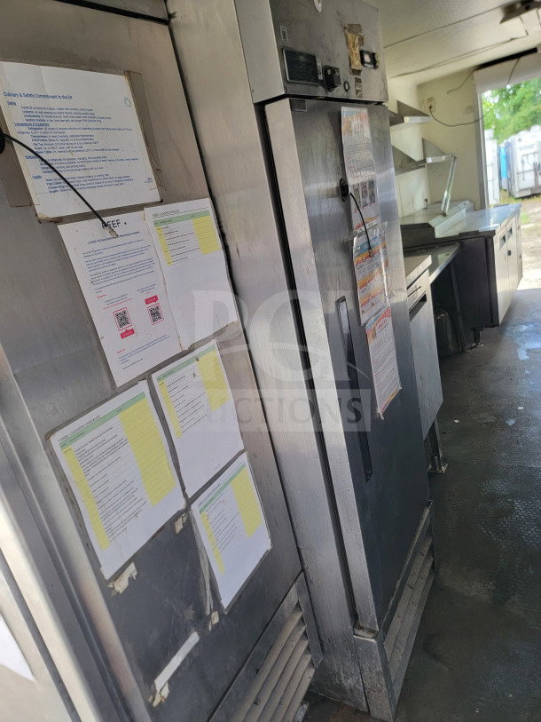2019 Diamond Cargo 8.5' x 24' mobile kitchen trailer interior featuring stainless steel appliances and safety instructions.