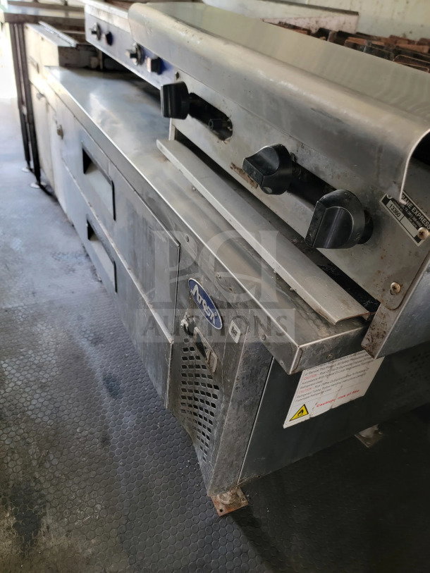 Diamond Cargo 2019 mobile kitchen trailer interior with American Range fry line, Globe electric griddle. Used condition.