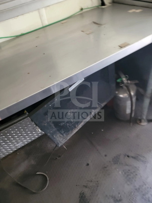 2019 Diamond Cargo 8.5' x 24' mobile kitchen trailer interior, featuring stainless steel surfaces and diamond plating.
