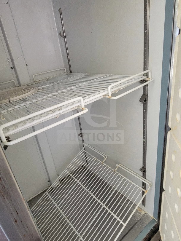 Diamond Cargo 8.5' x 24' mobile kitchen trailer interior. Equipped with shelving, potential kitchen application.