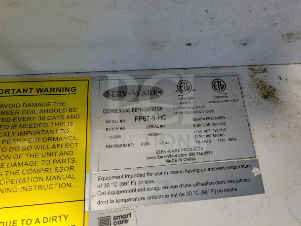 Label on Serv-Ware commercial refrigerator, model PP67-9-HC, with specifications and warnings about temperature and coil maintenance.