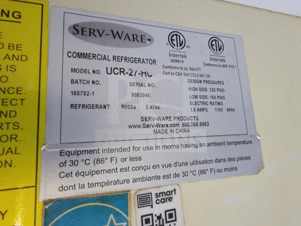 Serv-Ware commercial refrigerator label, model UCR-2/1-HC. Includes refrigerant details, design pressures, and electrical rating.