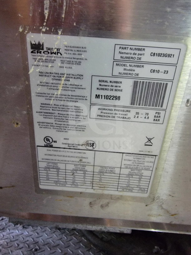 Tag on a mobile kitchen trailer shows brand "Taylor Crown" and model number "C810-23", details including serial number.