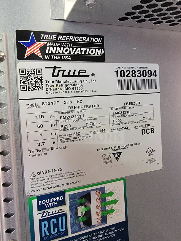 Alt text: True Refrigeration label on a refrigerator unit, model STG1DT-2HS-HC, indicating innovation made in the USA.