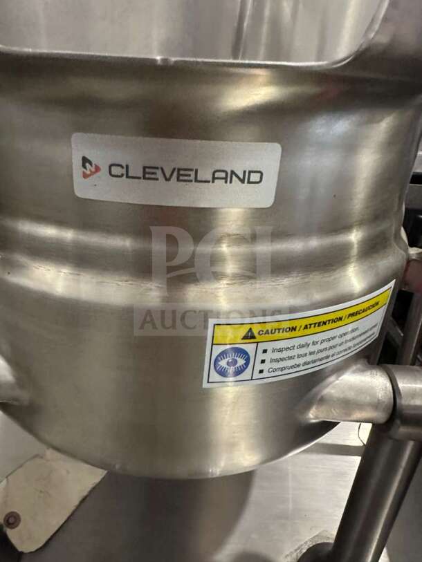 Brand new Cleveland 24GMK6200 gas steam kettle, 24-gallon, NSF & CSA certified. Features caution label, stainless steel body.