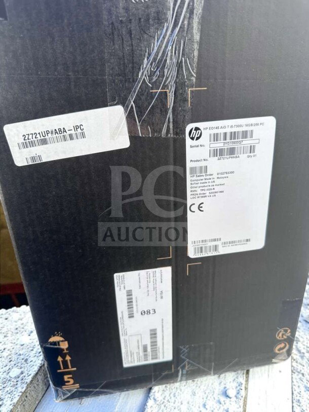Brand new HP Engage One AIO POS System, Model 145, in original box with labels displaying model and serial numbers.