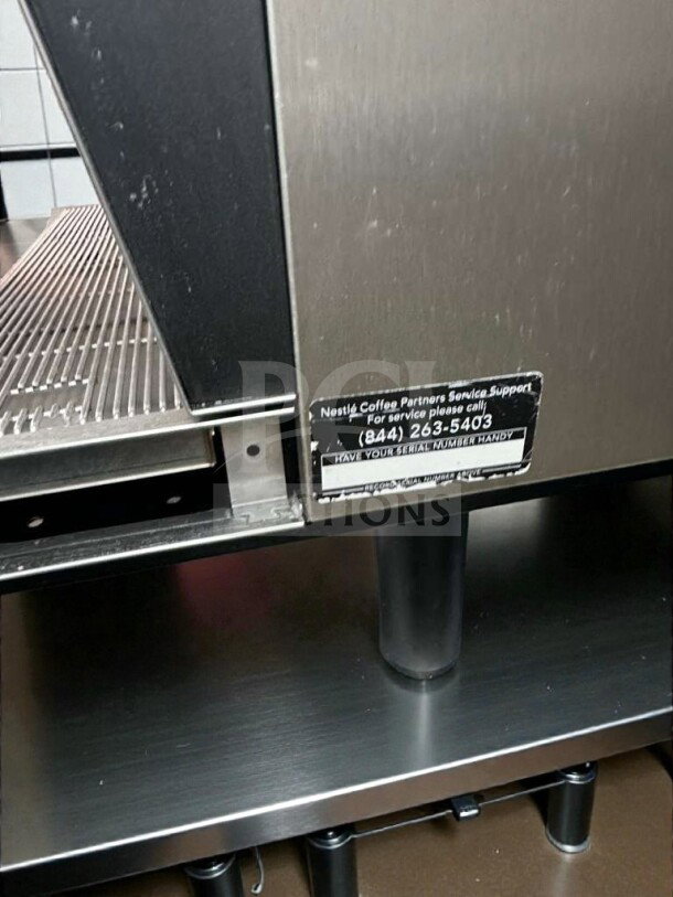 Thermoplan Black&White 3 espresso machine, stainless steel, UL & NSF listed, service label visible, premium condition.