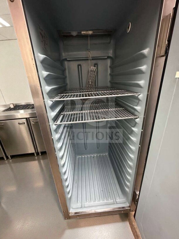 Delfield GSS2TL-8 commercial reach-in refrigerator, open view, two metal shelves, NSF & UL listed, fully operational.