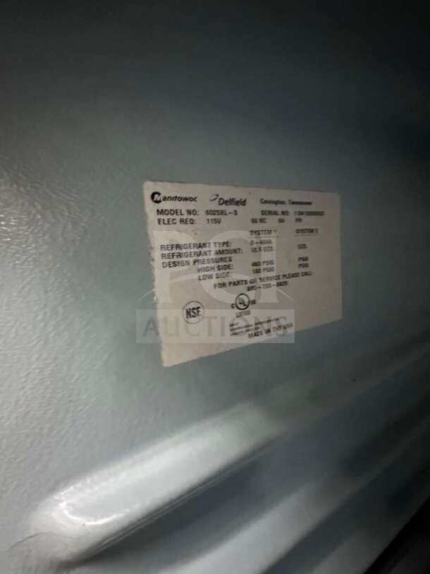 Label on Delfield GSS2TL-8 commercial refrigerator showing model, electrical requirements, UL and NSF certifications.