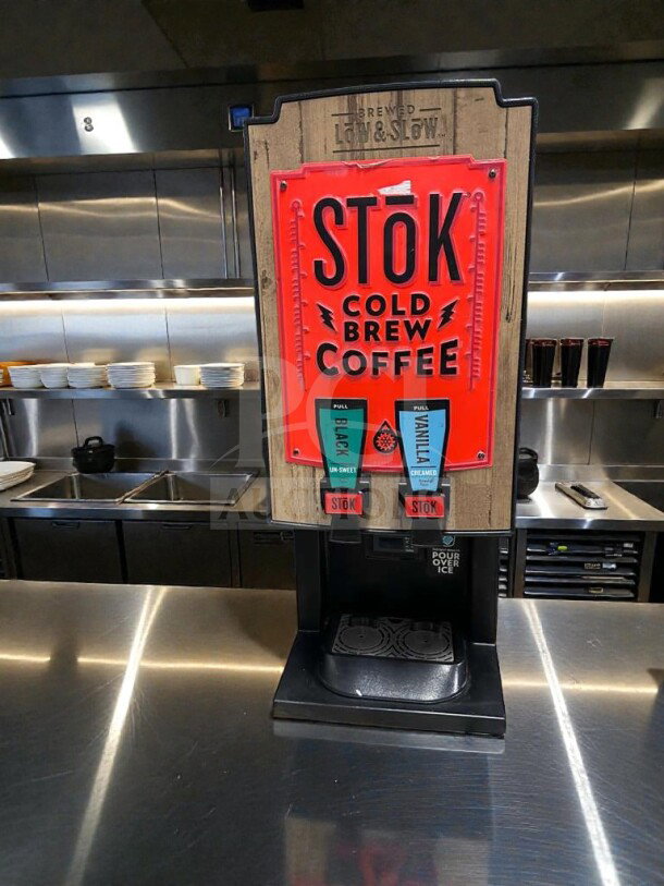 Outstanding condition STōK Cold Brew Coffee dispenser by Creamiser, model 230, 110V, fully tested and working, featuring pull taps for unsweet and creamy flavors.