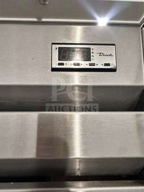 True STM1R-2HS commercial refrigerator control panel, stainless steel finish, featuring brand logo and buttons.