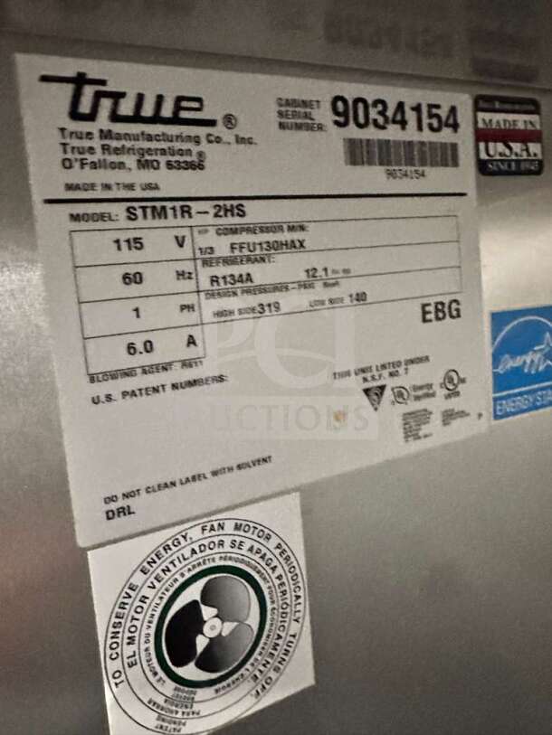 Label on exceptional condition True STM1R-2HS Roll-In Commercial Refrigerator. Model, voltage, and energy details visible.