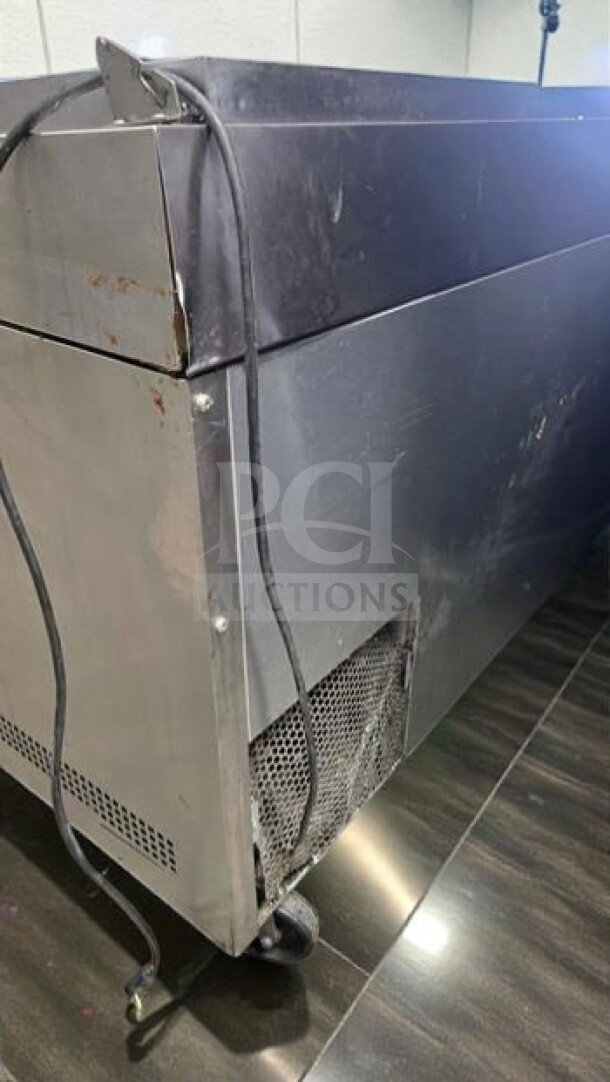 True TPP-93 commercial pizza prep refrigerator, 93-inch, three-door in superior condition. Visible cords and side panel detail.