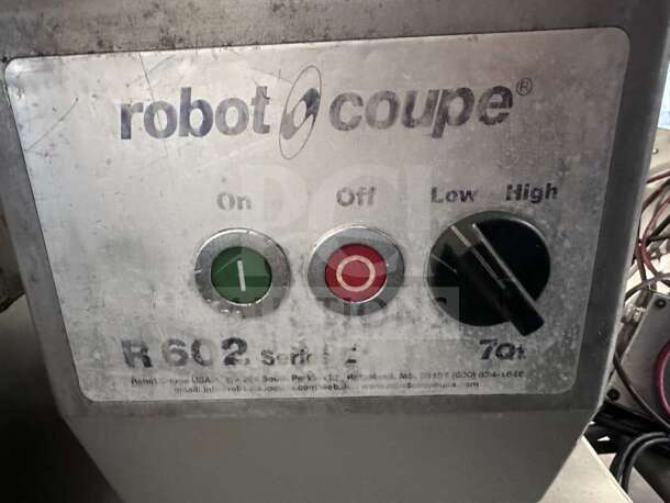 Robot Coupe R602 commercial food processor control panel, featuring power switch, speed settings, and label indicating model and capacity.