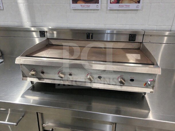 Commercial gas countertop griddle by Cooking Performance Group, model CPG-L-GRD-0405. Stainless steel, natural gas, fully tested, excellent condition.