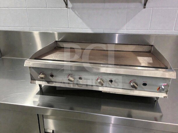 Commercial gas countertop griddle by Cooking Performance Group, model CPG-L-GRD-0405. Stainless steel, natural gas, fully tested.