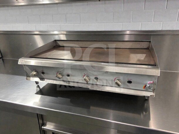 Commercial stainless steel gas countertop griddle by Randell, model CPG-L-GRD-0405, superior condition, fully operational.