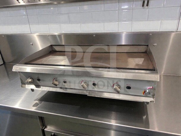 Commercial gas countertop griddle by CPG, stainless steel, fully operational, model CPG-L-GRD-0405, tested and in excellent condition.