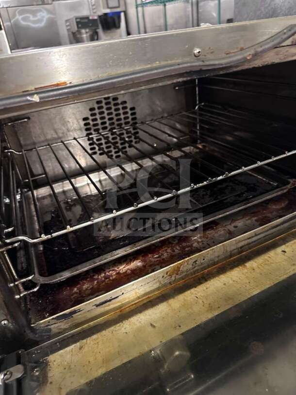 Cadco OV-013/XAF-013-US commercial countertop convection oven, 120V, NSF & UL listed, fully operational, interior view.