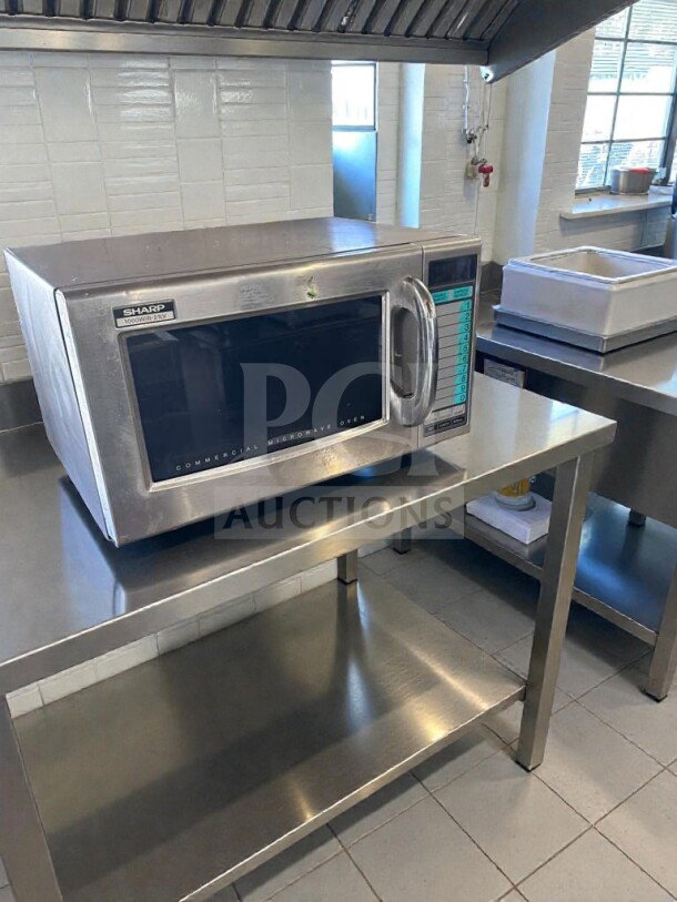 Sharp R-21LV commercial microwave oven, 1000W, stainless steel, in premium condition, fully tested, on a stainless steel countertop.