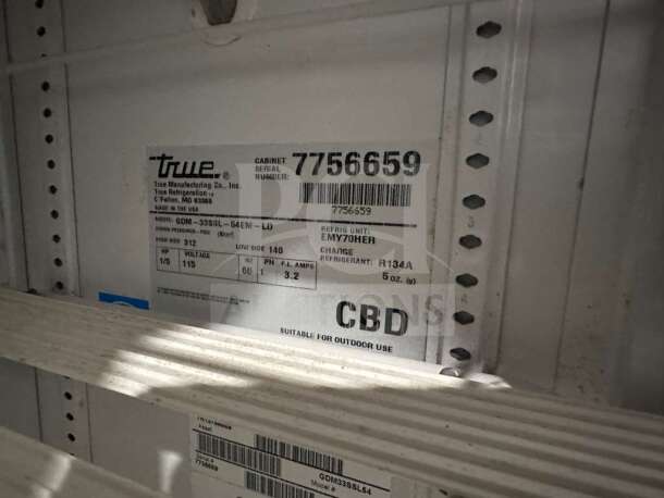 True GDM-33SL-54EM-LD glass door merchandiser, Coca-Cola branded, UL listed, fully operational, label details visible.