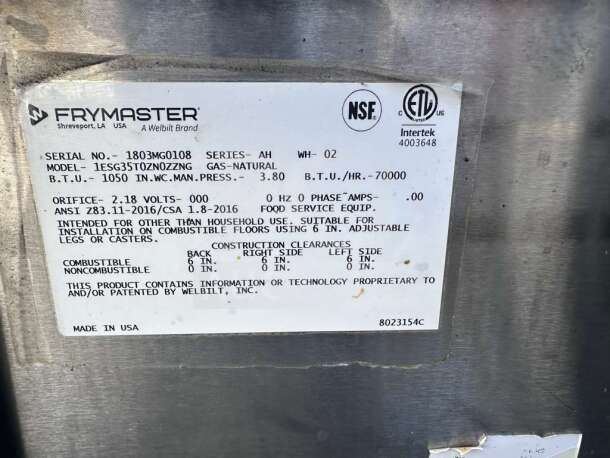 Label on Frymaster ESG35T Natural Gas Fryer, showing model, serial number, NSF & ETL certifications, and usage instructions.