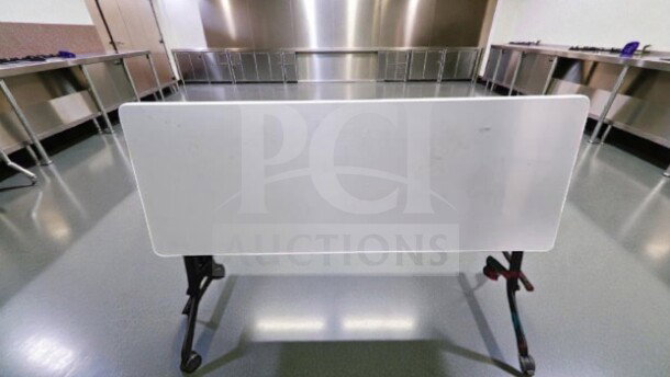Commercial Grade Folding Flip-Top Training Table, 6 ft, by Commercial Institutional Furniture. Rolling mobile frame, excellent condition.