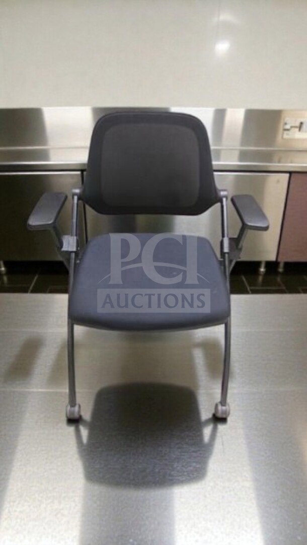 Commercial grade stackable training chair with arms by Commercial Institutional Furniture. Sled base, fully inspected, ready for use.