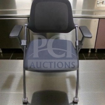 Commercial grade stackable training chair with arms by Commercial Institutional Furniture. Sled base, fully inspected, ready for use.
