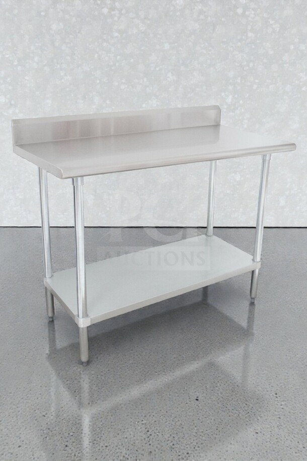 Brand new Advance Tabco KLAG-304-X stainless steel work table with backsplash. Scratch & dent condition. Model ADV-S-TBL-0052.