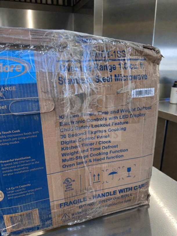 Boxed KoolMore KM-MOT-1SS over-the-range stainless steel microwave, 1.6 cu. ft., brand new, UL listed, fragile markings.