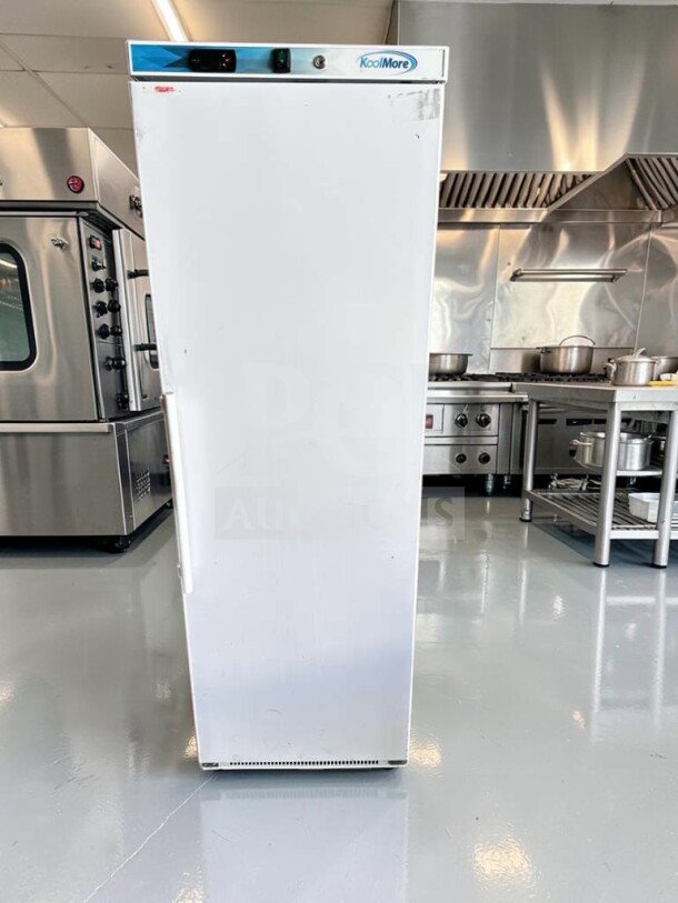 KoolMore KM-FMD12WH commercial freezer, 12 Cu. Ft., manual defrost, white, elite condition, fully tested, visible KoolMore branding.