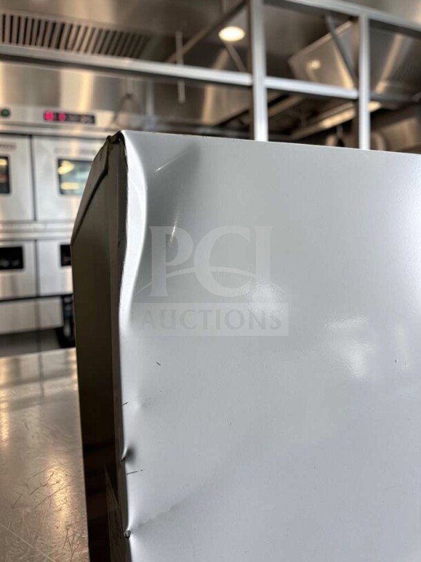 KoolMore KM-FMD12WH commercial freezer with minor dents, 12 Cu. Ft., manual defrost, white finish, fully tested operational.