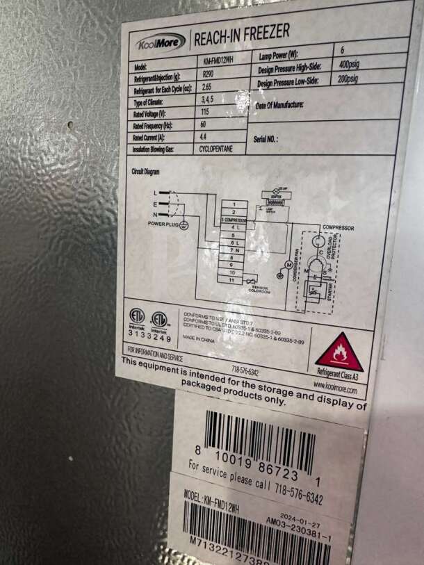 KoolMore KM-FMD12WH commercial reach-in freezer label showing model, specs, and refrigerant details. Fully tested, 12 cu. ft., manual defrost.