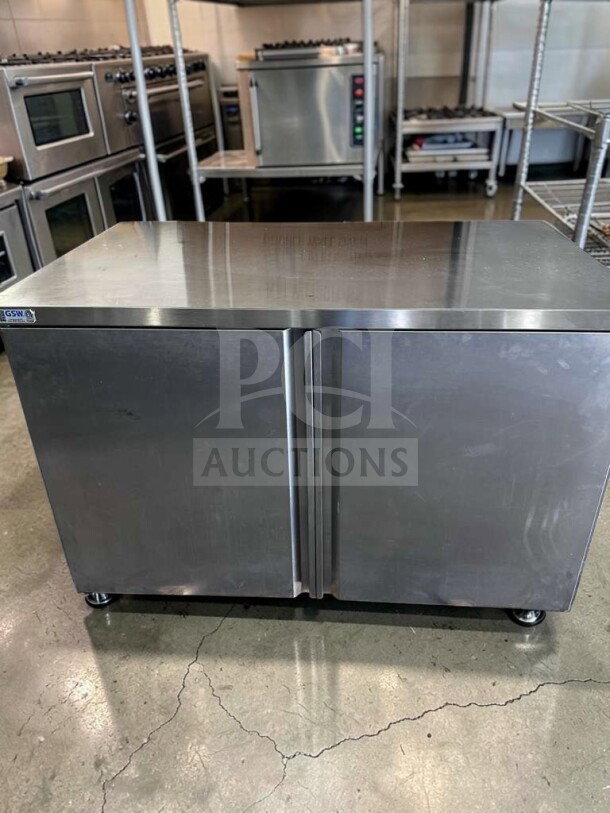GSW CTD-P3048H stainless steel work table; 48" with hinged doors, mid-shelf, in outstanding condition, fully tested.