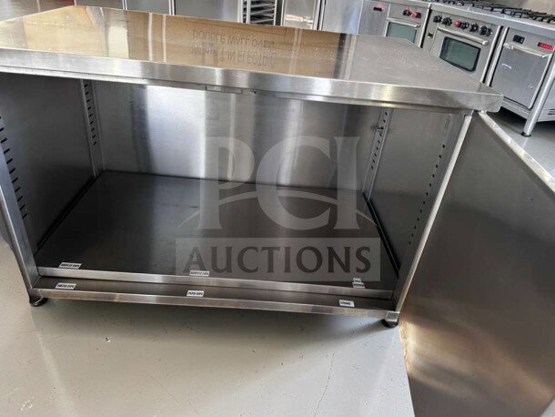 GSW CTD-P3048H 48” stainless steel commercial work table with hinged doors and mid-shelf, outstanding condition.