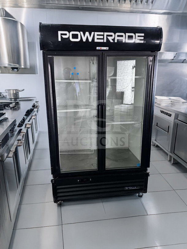 True GDM-43EM commercial glass door refrigerator, two doors, black frame, "Powerade" branding, excellent condition.